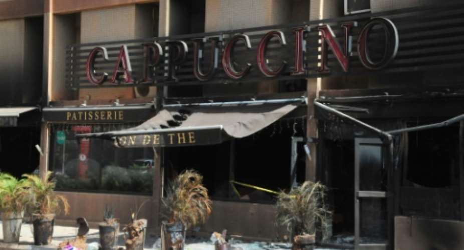 The Cappuccino Cafe located near the Splendid Hotel, both destroyed earlier by Al-Qaeda in the Islamic Maghreb , in Ouagadougou, on January 21, 2016.  By AHMED OUOBA AFPFile