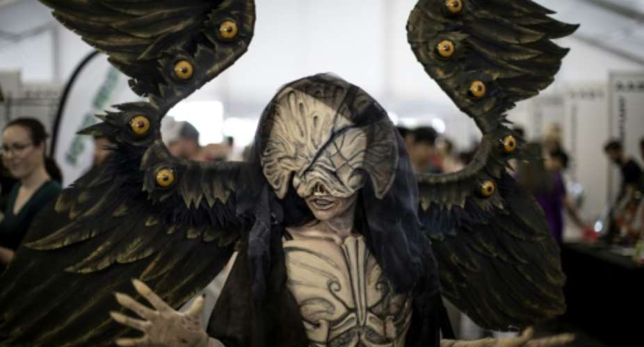 The convention includes costume competitions, all-night gaming tournaments, video game launches and virtual reality experiences, as well as appearances by film and TV stars, artists and designers.  By MARCO LONGARI AFP