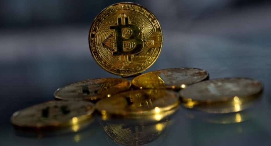 The difficulty of transferring money in sub-Saharan Africa has made cryptocurrencies attractive for Nigerians despite the volatility of bitcoin.  By Justin TALLIS AFP