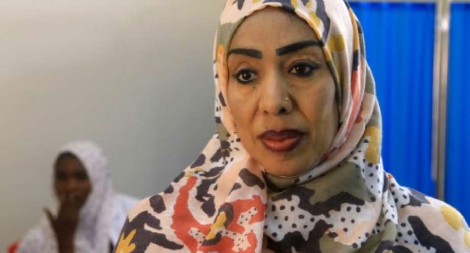 The director of the reopened Saudi maternity hospital in Omdurman, Dr. Safaa Ali, has not seen her family since they fled to Egypt when war broke out nearly two years ago..  By Ebrahim Hamid (AFP)