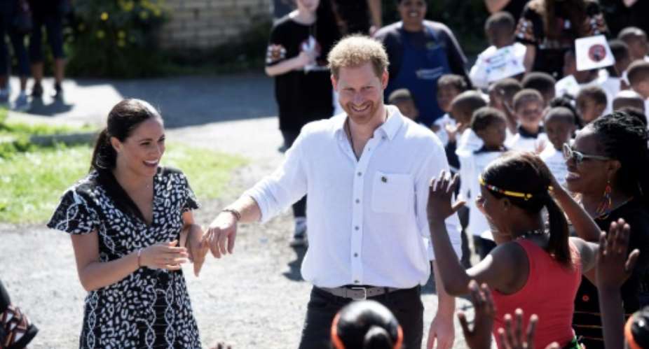 The Duke and Duchess of Sussex met members of the Justice Desk, a rights group in Cape Town's Nyanga township.  By DAVID HARRISON POOLAFP