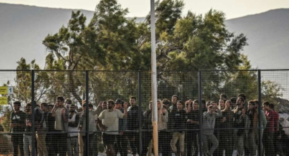 The emergency legislation allows authorities to detain asylum seekers in camps for up to 18 months.  By Aris MESSINIS (AFP)