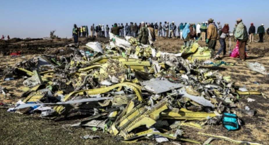 The Ethiopia Airlines jet nose-dived into a field outside Addis Ababa, killing all 157 people onboard.  By Michael TEWELDE AFP
