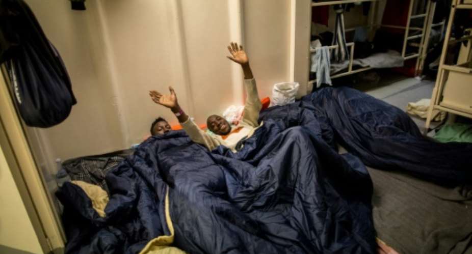The exhausted migrants, including 15 minors, cheered and hugged the crew as the ship sailed into the harbour.  By FEDERICO SCOPPA (AFP/File)
