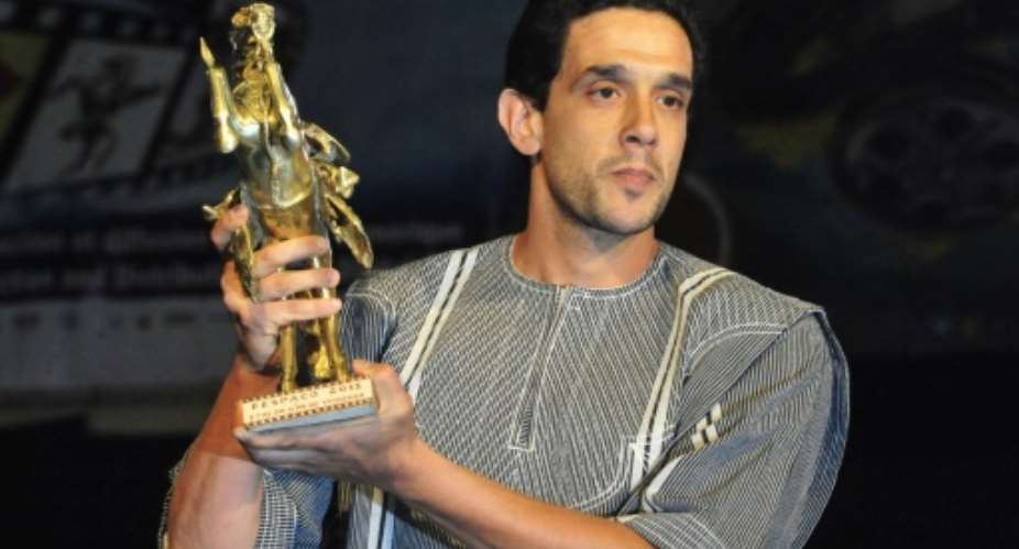 The festivals top prize is Golden Stallion of Yennenga, seen here in the hands of Moroccan director Hicham Ayouch, who won the trophy in 2015 for his film Fievres (Fevers).  By AHMED OUOBA (AFP)