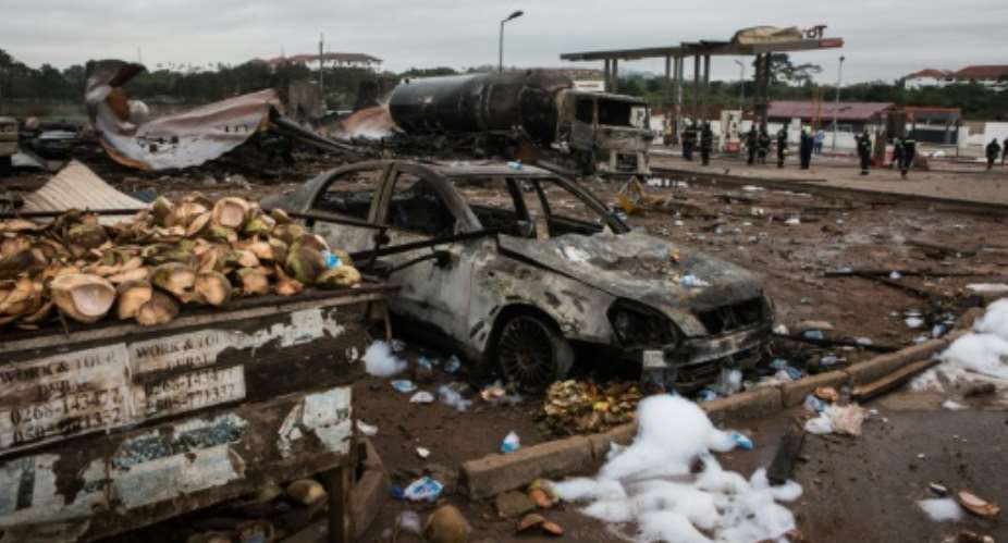 The fire and blasts gutted a liquefied gas filling station and a nearby petrol station in a suburb of Accra..  By Ruth McDowall AFP