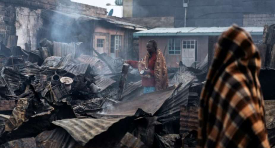 The fire in Nairobi's Kawangware slum began after several groups of young men from different ethnic groups began fighting over Thursday's divisive election.  By Marco LONGARI AFP