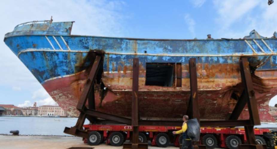 The fishing boat in which up to 900 migrants died will be exhibited at the Venise Biennale art fair.  By Tiziana FABI AFP