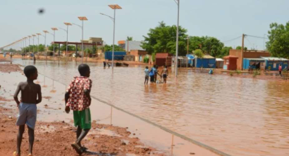 The flooding in Niger's capital Niamey caused houses to collapse, killing 14 people, most of them children.  By BOUREIMA HAMA AFP