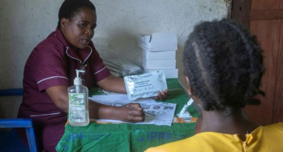 The foreign funding squeeze on Malawis healtcare system has triggered siginificant cuts in HIV treatments, a spike in pregnancies and a return to discrimination.  By Amos GUMULIRA (AFP)