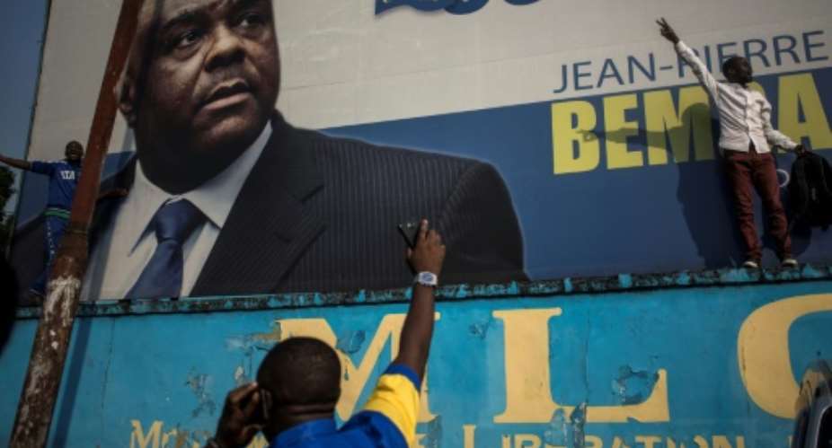 The former vice president of DR Congo Jean-Pierre Bemba here pictured on a poster at the Congolese Liberation Movement headquarters, was acquitted last month of war crimes and was on Friday named by his party as a candidate in presidential polls planned for December.  By JOHN WESSELS AFP