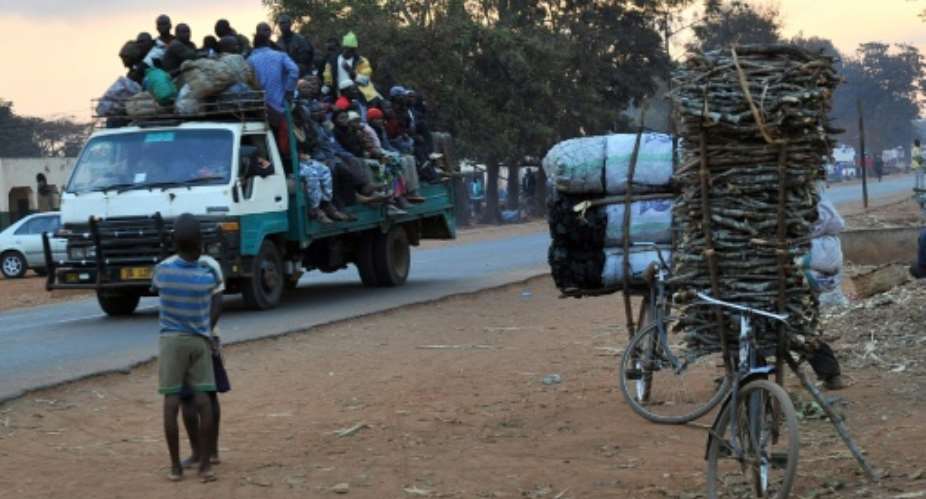 The fuel shortage has forced many Malawians to cycle.  By ALEXANDER JOE AFPFile