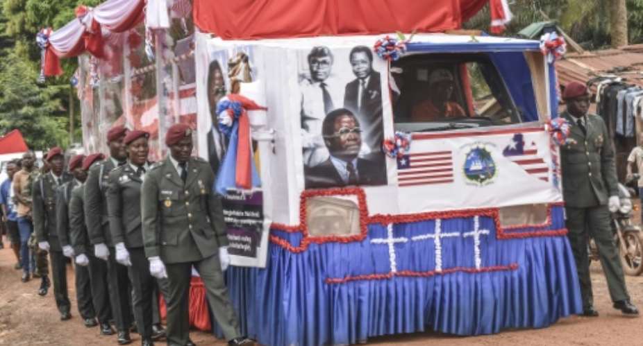 The funeral cortege for former Liberian president Samuel Doe and his wife Nancy was escorted by members of the armed forces.  By Matthew Jacobs (AFP)