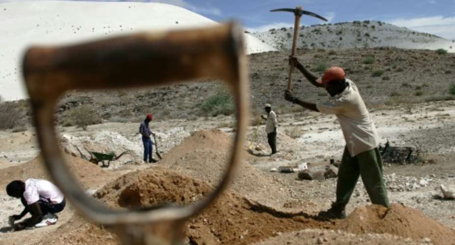 The government hopes the rule change will attract more mining investment.  By ALEXANDER JOE AFP