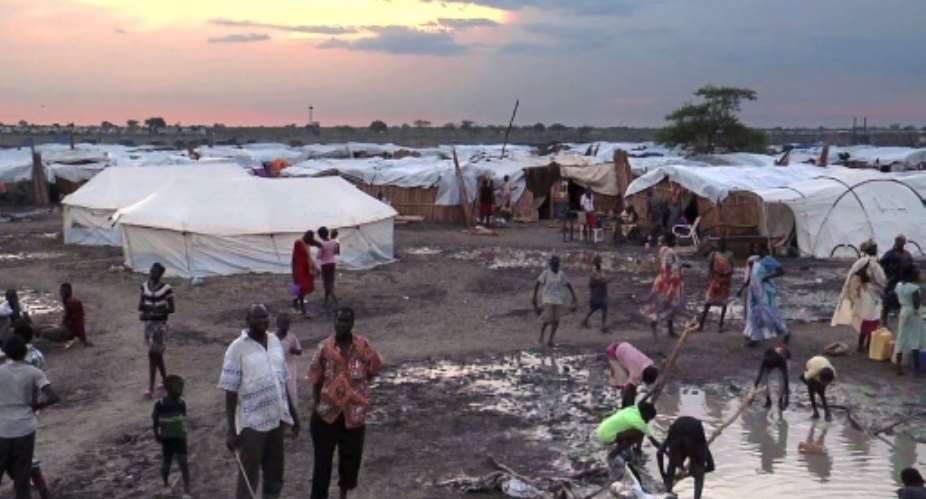 The IDP camp at Bentiu in northern South Sudan is a collection of mud-and-tarp houses arranged in blocks and bracketed by trenches of slimy green sewage that serve as playgrounds for children.  By - UNMISSAFPFile