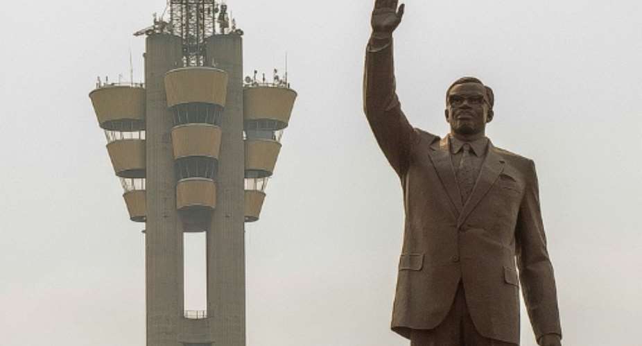 The imposing statue of first prime minister after independence Patrice Lumumba dominates the traffic in Kinshasa.  By Arsene MPIANA AFP