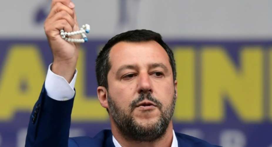 The interior minister described himself as a good Catholic after sparking an outcry for holding up a rosary during a rally of the European far right in Milan on Saturday.  By Miguel MEDINA AFPFile