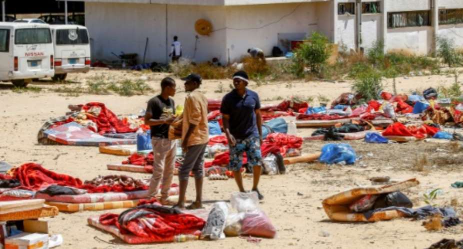 The International Organization for Migration says aound 300 migrants are still being held in a Libyan detention centre just days after aan air  strike there killed 44 migrants.  By Mahmud TURKIA AFP
