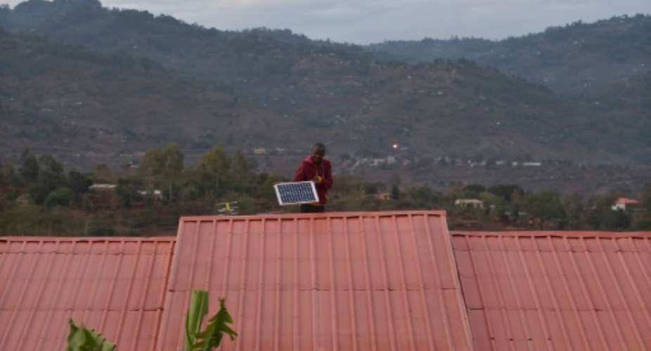 The lack of a secure electricity supply has seen some Kenyans install solar panels.  By TONY KARUMBA AFPFile