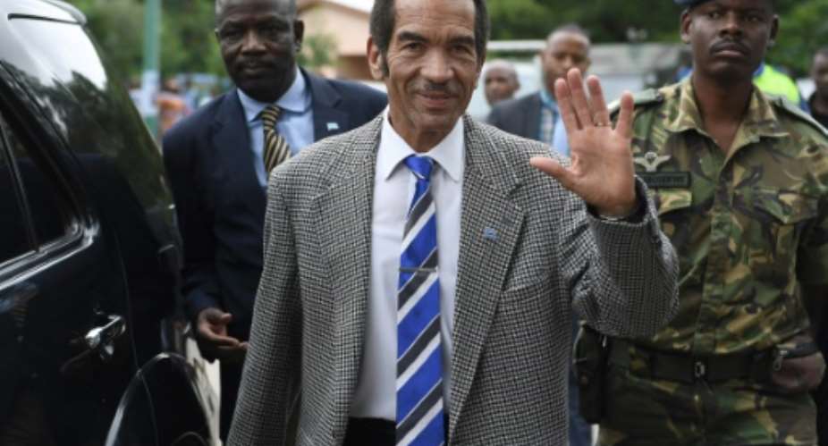 The long goodbye: Botswanan President Seretse Ian Khama waves to the crowd in his village of Serowe -- the last stage of a farewell tour of the country's 57 constituencies before he stands down on Saturday.  By MONIRUL BHUIYAN AFP