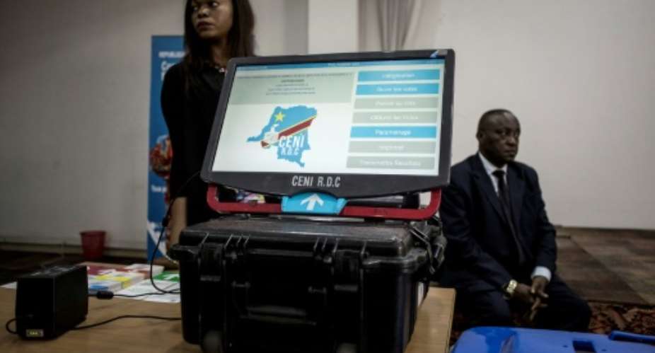 The machine comprises a tactile screen with photos of the candidates. The voter receives a printout of his or her choice on a paper, which is then put into a ballot box to provide backup verification, according to the organisers.  By John WESSELS AFP