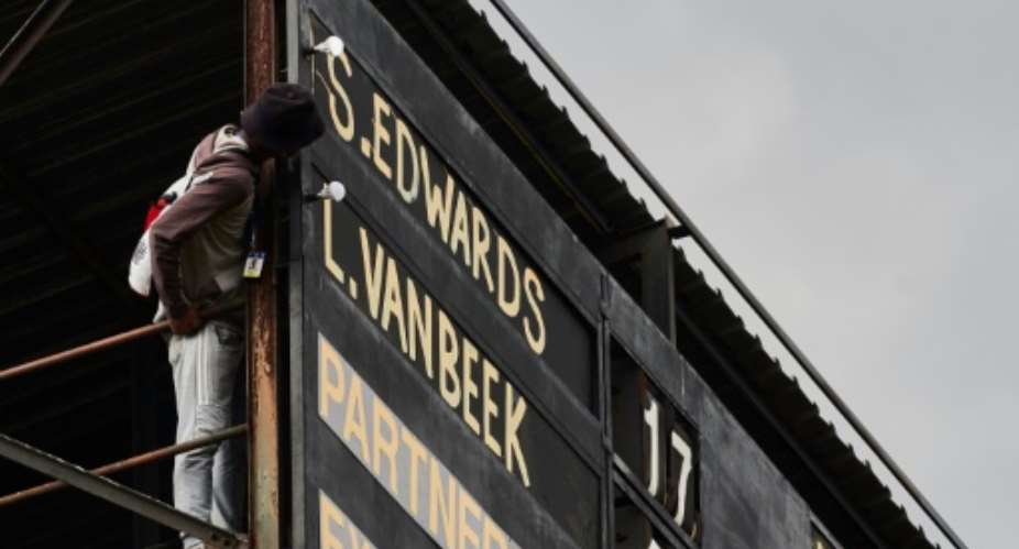 The manually operated scoreboard in Bulawayo is one of the last of its kind in international cricket.  By Zinyange Auntony (AFP)