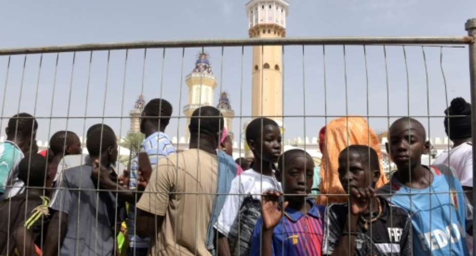 The mother of all queues: Trying to get into Touba's mosque during the big weekend.  By SEYLLOU AFP