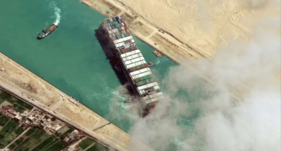 The MV Ever Given container ship blocked the Suez Canal for six days in March, crippling global supply lines and costing billions.  By - Satellite image 2021 Maxar TechnologiesAFPFile