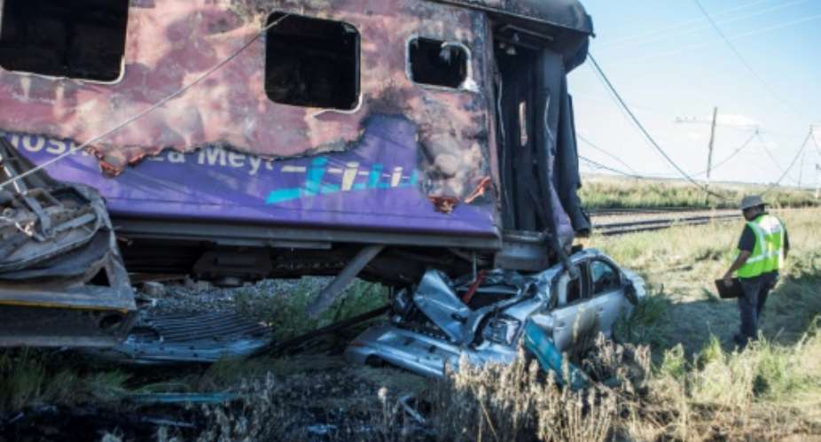 The passenger train collided with a lorry at a level crossing and burst into flames on Thursday.  By WIKUS DE WET AFPFile