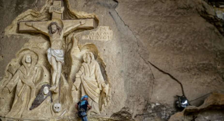 The Polish artist has spent more than two decades carving the rugged insides of the seven cave churches and chapels of the monastery with designs inspired by biblical stories.  By Mohamed el-Shahed AFP