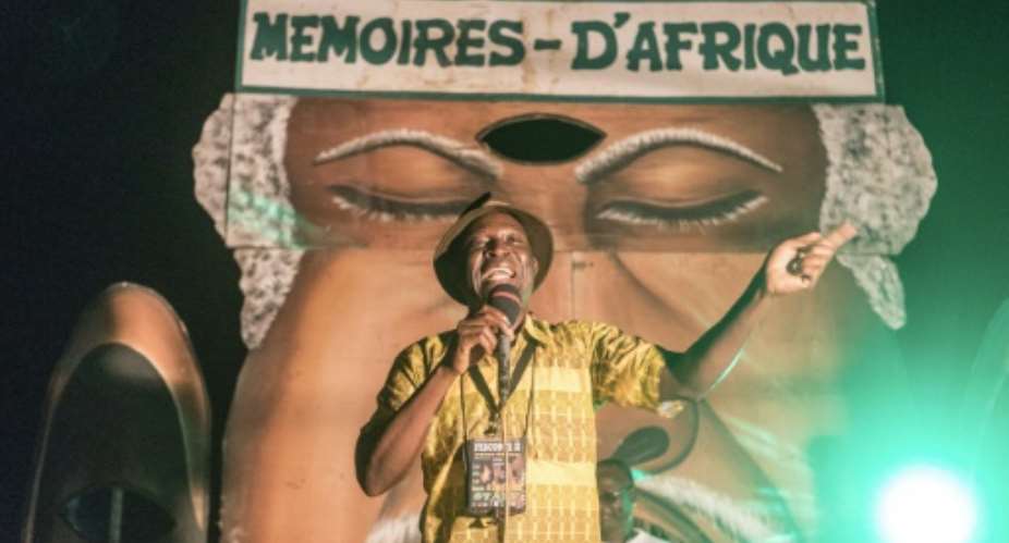 The power of the word: A professional storyteller in action at the 'Memories of Africa' festival.  By YANICK FOLLY AFP
