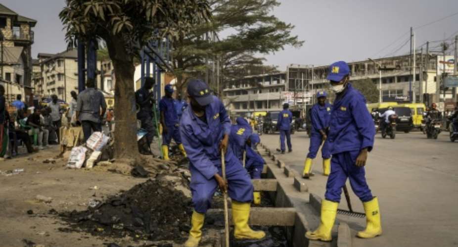 The recruits, nicknamed builders, appeared on the streets in June.  By GLODY MURHABAZI (AFP)
