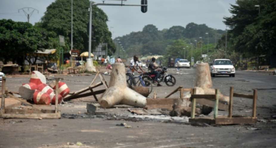 The remains of a street barricade in Yamoussoukro, the Ivorian capital, after post-election clashes.  By SIA KAMBOU AFP