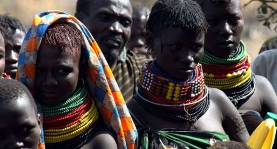 Turkana women wait for food aid. More than 94 percent of the population of Turkana lives below the poverty threshold.  By Stringer (AFP/File)