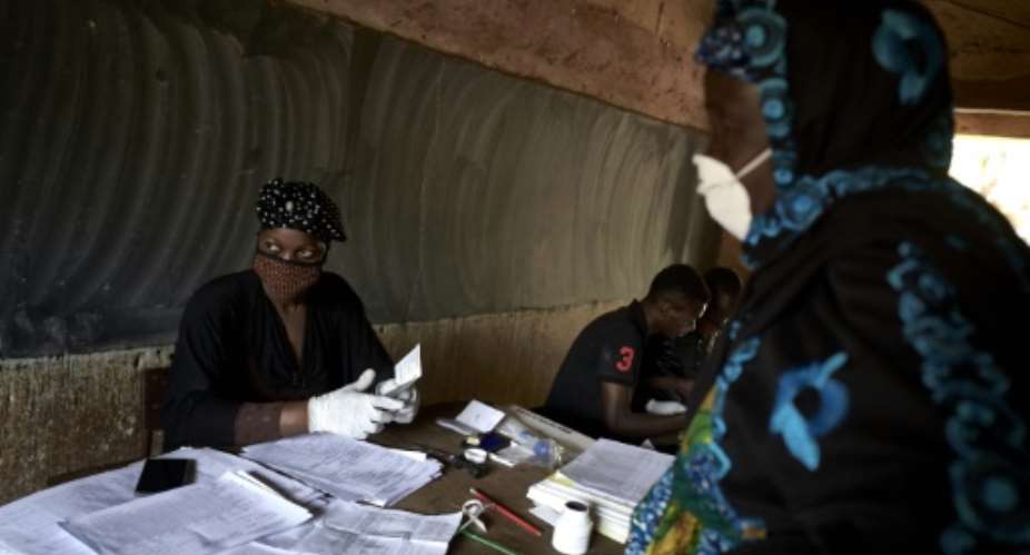The risk of catching coronavirus looms over a parliamentary election in Mali.  By MICHELE CATTANI AFP