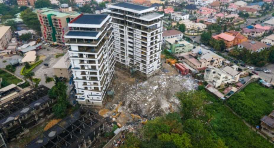 The rubble from where a 21-storey building collapsed in Nigerias commercial capital Lagos.  By Benson Ibeabuchi (AFP)