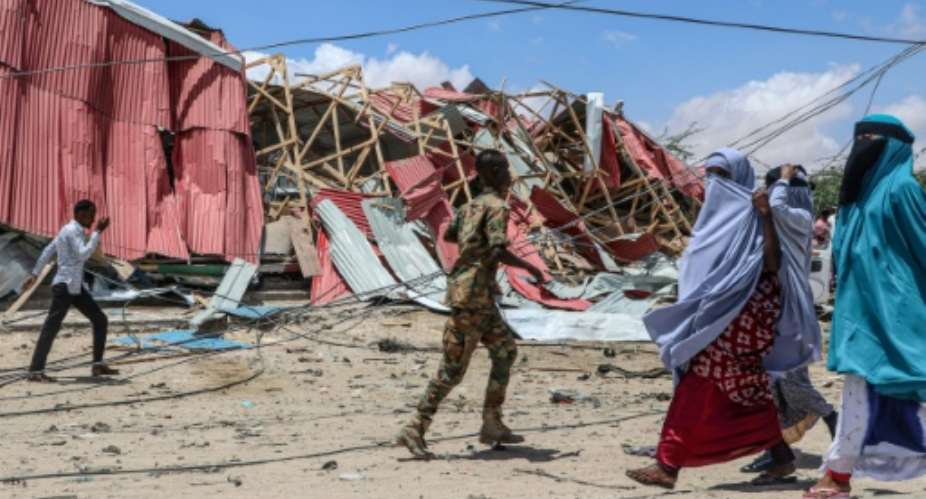 The scene of a 2019 suicide car bomb explosion in Mogadishu, Somalia claimed by the Al-Shabaab militant group.  By Abdirazak Hussein FARAH AFPFile