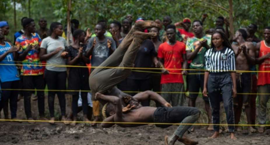 The 'soft ground wrestling'  copies the style of the World Wrestling Entertainment WWE in the United States..  By Badru Katumba AFP