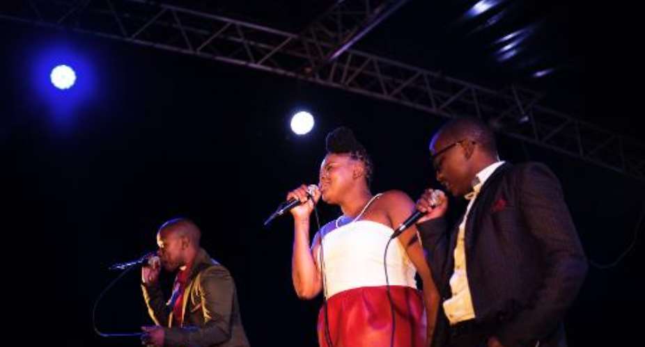 Members of the South African a capella group The Soil, Ntsika Ngxanga R, Buhle Mda C and Phindo Ngxanga L perform in Johannesburg on February 15, 2014.  By Marco Longari AFPFile