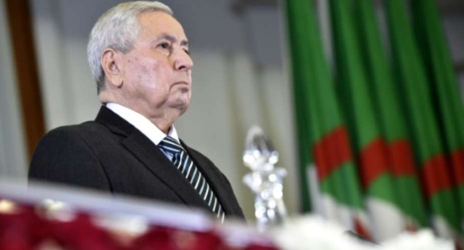 The speaker of the upper house of the Algerian parliament, Abdelkader Bensalah, has been elected by fellow MPs as the country's first new leader in 20 years after the resignation of Abdelaziz Bouteflika in the face of mass protests.  By RYAD KRAMDI AFP