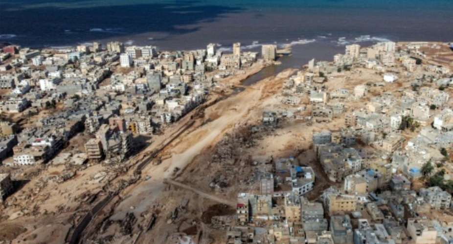 The tsunami-sized flash flood broke through two dams and razed entire neighbourhoods of Libyas Derna.  By Mahmud TURKIA (AFP)
