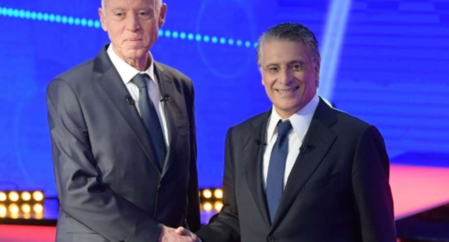The two candidates -- conservative law professor Kais Saied and business tycoon Nabil Karoui -- went head-to-head to convince Tunisia's seven million voters in a televised debate before a media blackout went into effect Saturday.  By Fethi Belaid AFP