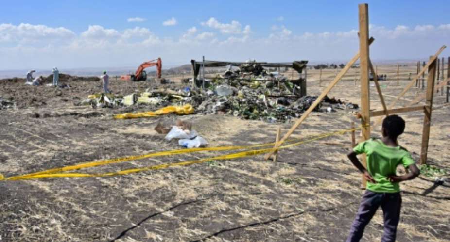 The two planes' flight recorders provided the strongest indication yet that an anti-stall system malfunctioned in both the Ethiopian Airlines crash of March 10, 2019 -- the aftermath of which is seen here -- and Lion Air's 2018 crash in Indonesia.  By TONY KARUMBA AFPFile