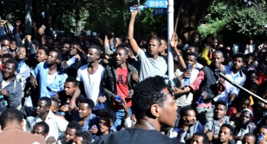 The unrest was triggered when media mogul Jawar Mohammed, an Oromo activist, claimed that security forces had plotted an attack against him. Shown here are supporters at a rally outside his home.  By STRINGER AFPFile