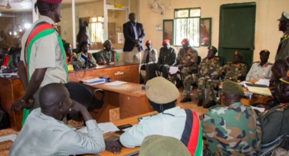 The verdicts for 10 South Sudanese soldiers are announced at the military court in Juba, South Sudan. They were found guilty for their role in a hotel attack in which five foreign aid workers were gang-raped and a journalist was killed..  By Akuot CHOL AFP