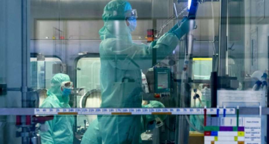 The virus has now killed more than 596,000 people and infected over 14,074,000 as it continues to surge across the globe despite months of unprecedented lockdowns to stop its spread.  By JOEL SAGET AFP