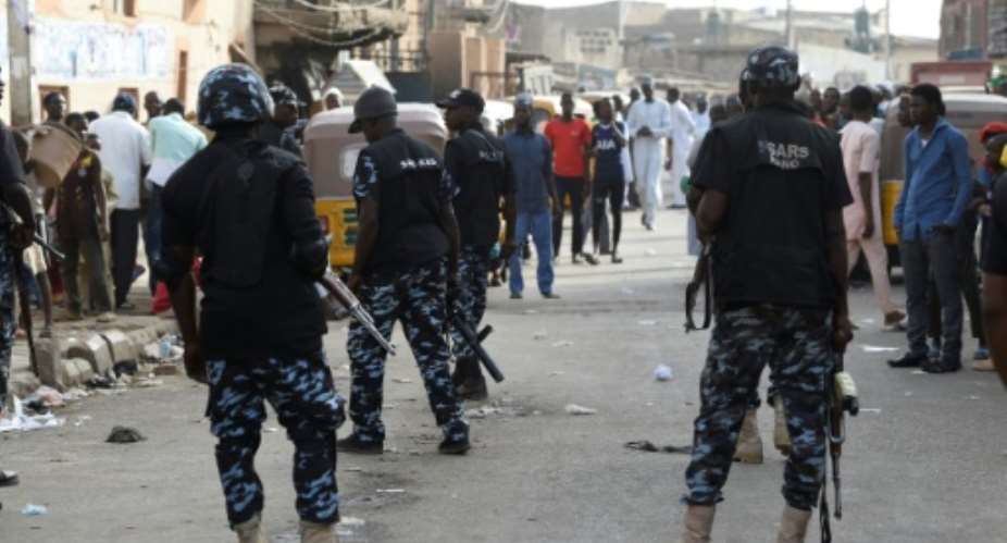 The weekend shooting renewed public anger over police units like the Special Anti-Robbery Squad SARS, seen here in Kano in February, whose members have been accused of brutality, extra-judicial killings and exortion.  By PIUS UTOMI EKPEI AFPFile