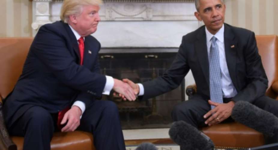 The White House transition from Barack Obama to Donald Trump the pair are seen here after Trump's election in November 2016 has been one of the most stark in US history.  By JIM WATSON AFPFile