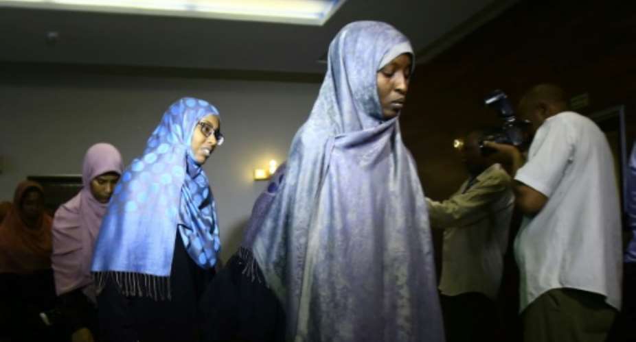 The women were presented to the media on their return to Sudan.  By ASHRAF SHAZLY AFP