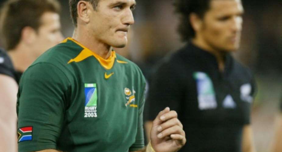 Then South Africa scrum-half Joost van der Westhuizen L leaves the field at the end of the Rugby World Cup quarter-final against New Zealand at the Telstra Dome Stadium in Melbourne on November 8, 2003.  By William WEST AFPFile
